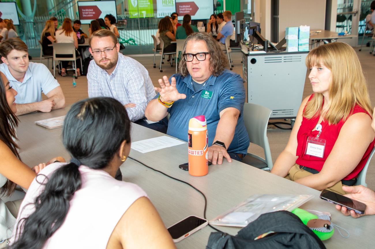 HCOM groups gather to debrief after Rethinking Poverty experience