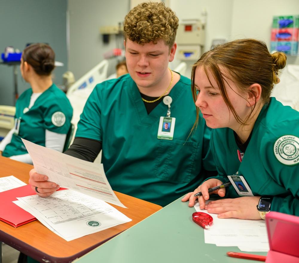 two nursing students in a lab