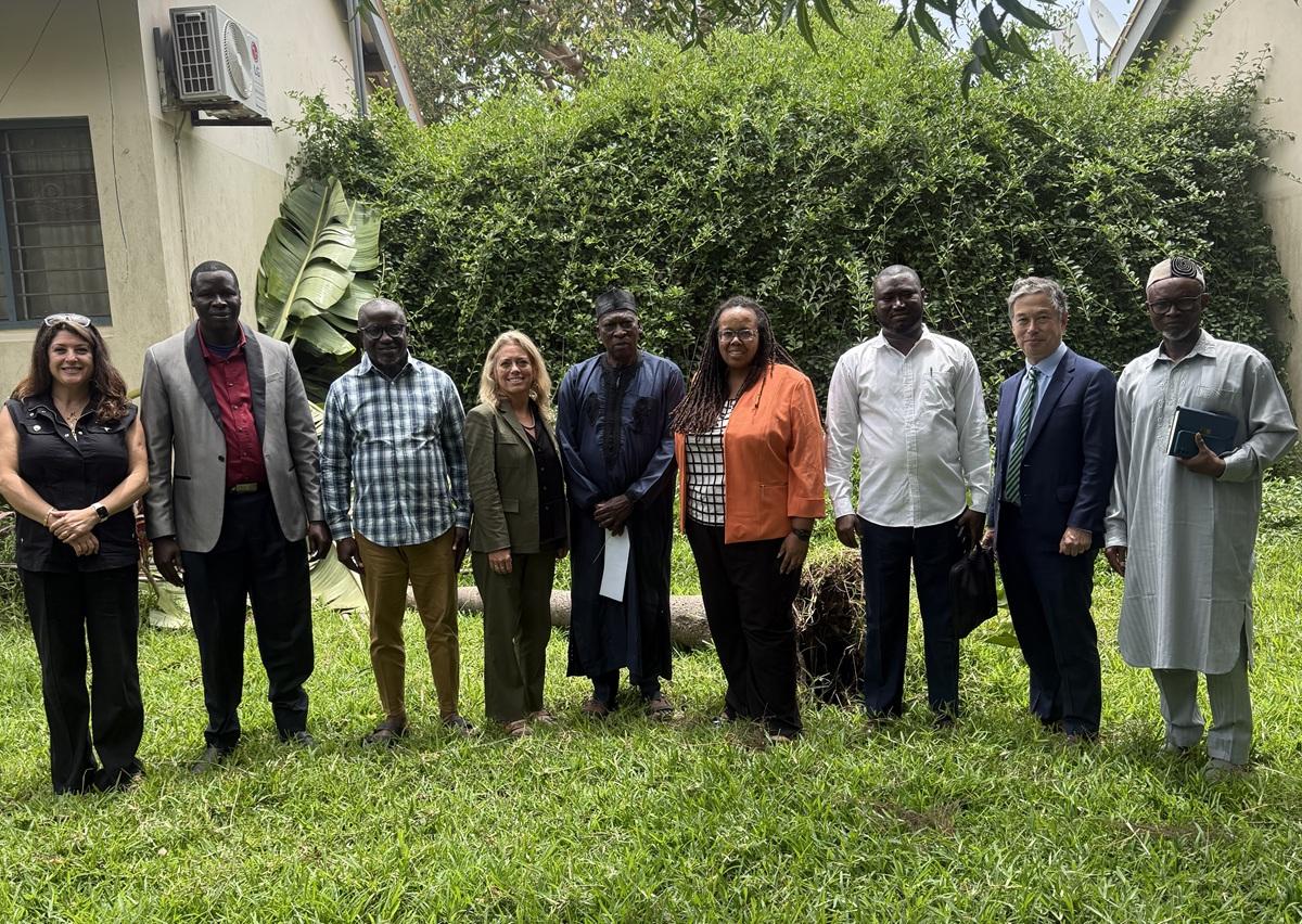 OHIO representatives stand outside with partners during a visit to several countries in West Africa.