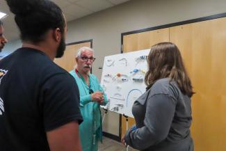 OhioHealth simulationist Ricko Steffl talking with a high school camper