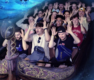 Students pose for photo on rollercoaster