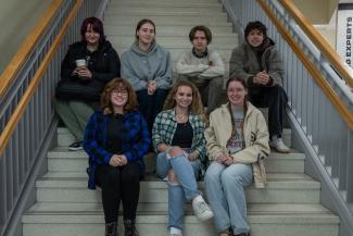 Students pose for photo on steps