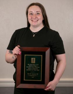 HCOM alum Kate Spencer receives award at OOS