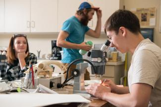 Students analyzing artifacts from the Shoop Paleoindian site.