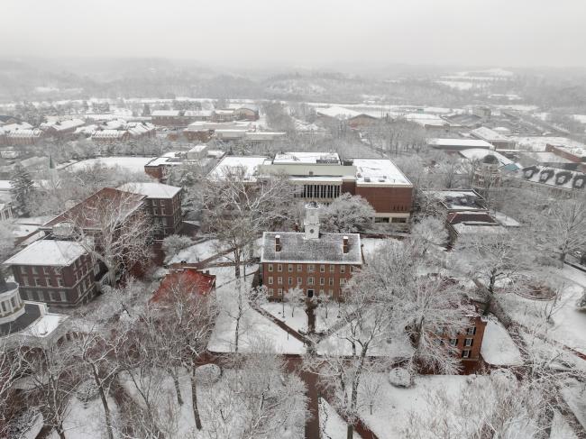 Cutler Hall,  the College Green and the trees and buildings nearby are covered in snow in this aerial image