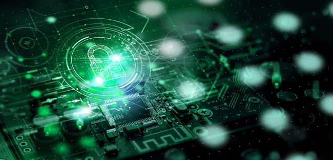 Rendered image: Green tinted circuits interwoven with a metallic green padlock, symbolizing cybersecurity. Associated with Ohio University.