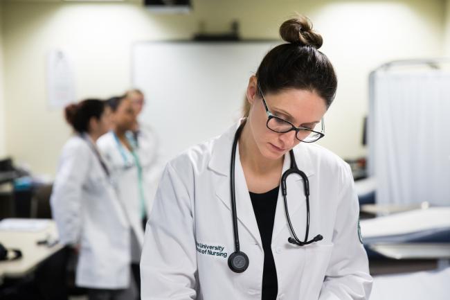 Ohio University's nationally ranked BSN to DNP program student earning their degree online and in clinical setting.