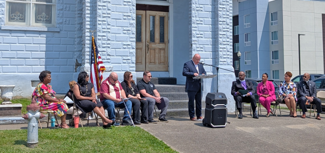Marty Conley speaks at the dedication ceremony outside of the Quinn Chapel AME Church