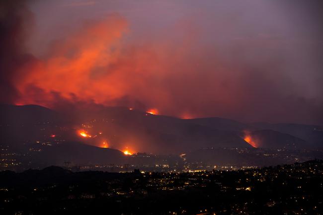 Fires burn on the dry hills surround the Los Angeles area.