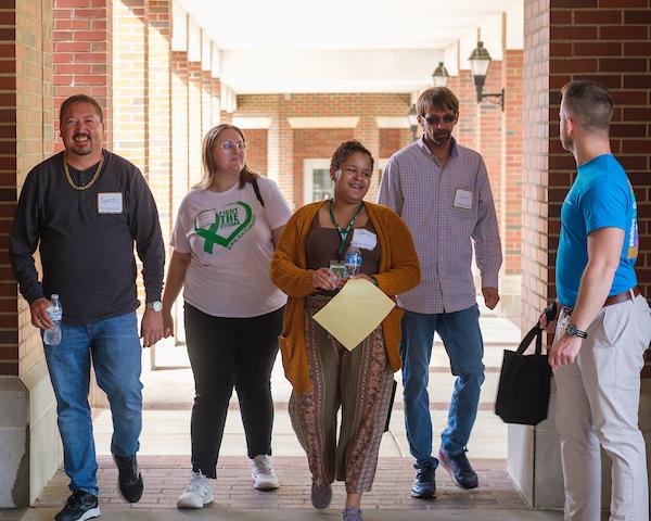 conference attendees walking outside in a group