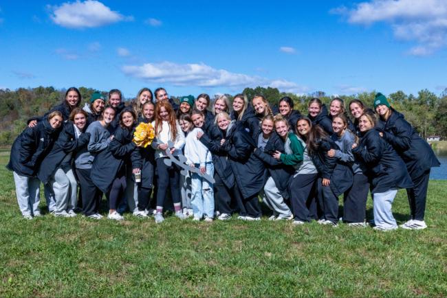 OHIO Soccer team and Ivy Weaver with gold flower