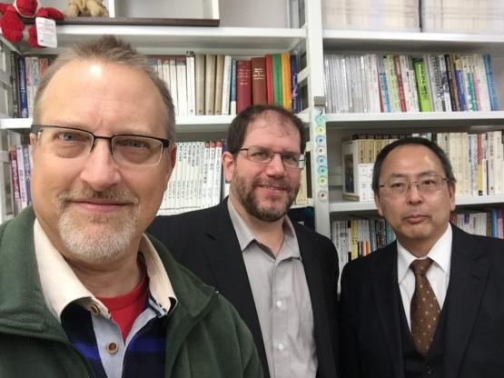 Thompson, King and Yanagi pose for a picture with bookcases behind them