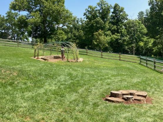 A Wickiup structure and log stepping stones