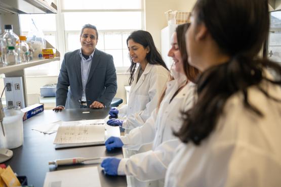  Dr. Vishwajeet Puri works with students 