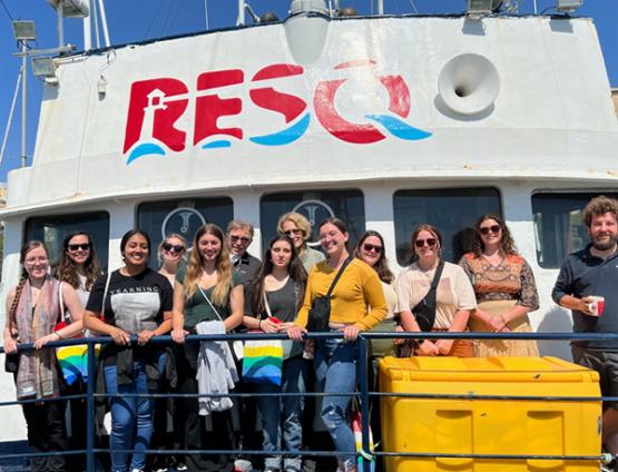  Students pose on the deck of the RESQ ship in Sicily
