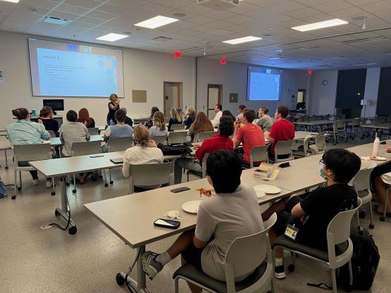 Students watch presentation from an ASL instructor.