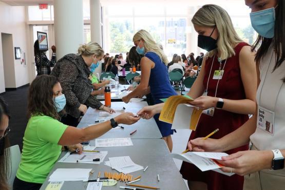 Students line up at the stations during the workshop.