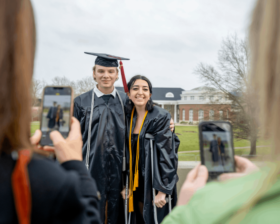  Graduates pose for photos following Fall Commencement. 