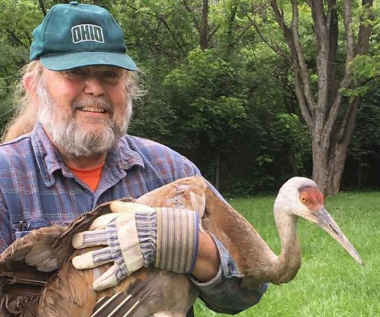  Scott Moody with a Sandhill Crane in 2017.