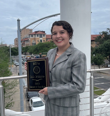 Mackenzie Joseph is shown holding the championship award