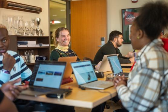 OHIO Business students are shown working together on a project 