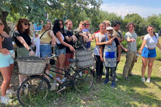  Showing off their woven jewelry (left-to-right) Gabrielle Dozer, Kate Dinan, Chloe Chesnik, Liz Meserini, Gavin Morgan, Jacob Walthur, Susi Kimbell (Exedra Director), Theresa Moran (Food in Sicily Faculty), Orlando Gonzalez, Aj Mater, and Olivia Epperly with (front) Rosella Di Brigida and Claudio Romano (owners and hosts of Casa Contadina Iblea). 