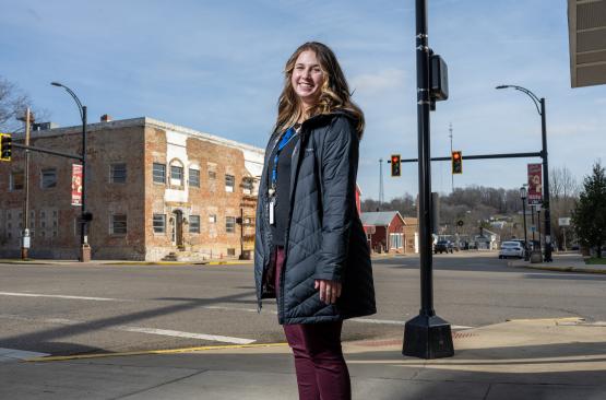  Lauren Nemeth, BSW &amp;#039;22, stands at an intersection in McArthur, Ohio. 