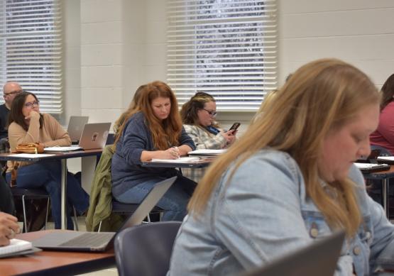  Students in class writing 