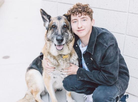  Matt Nelson is shown next to a dog 