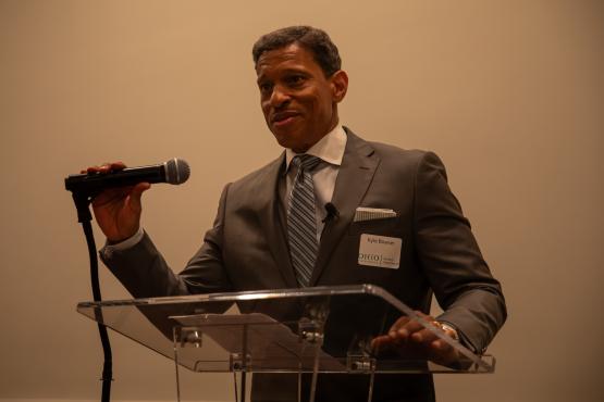  Kyle Bowser speaks at a dais 