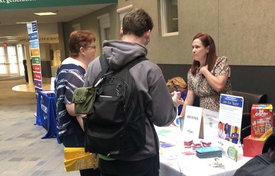 A representative from Kroger talks with OHIO students