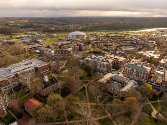  A drone photograph of Ohio University&#039;s campus, with College Green in the foreground and the Convocation Center in the distance 