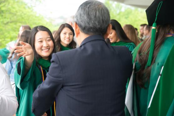 HCOM graduate and family celebrate commencement