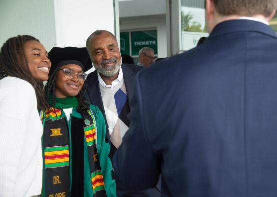 HCOM graduate and family celebrate commencement