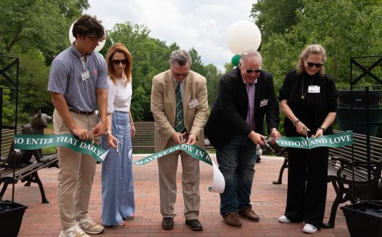 Family members and friends cut the ribbon at the grand opening ceremony 