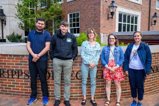 The Scripps Communication Fellows are shown outside of the Schoonover Center