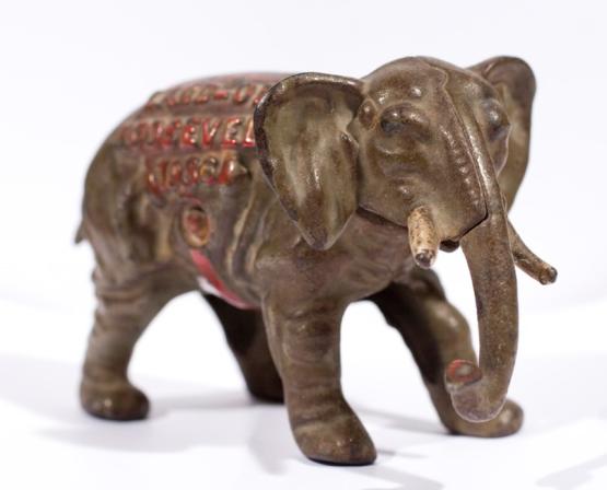 A small elephant statue with "Roosevelt 1938" engraved on it