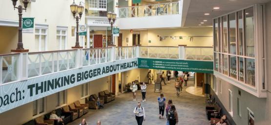  A photo from the second floor looking down at students walking through the Grover Center Atrium 