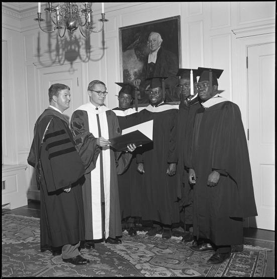 OHIO President Vernon Alden presents degrees to OHIO students in this photo from the 1960s.