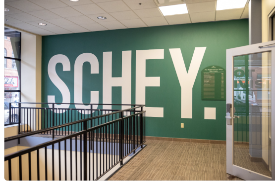  An interior shot of the Schey Sales Centre building. The words &quot;SCHEY.&quot; are in big letters on the wall. 