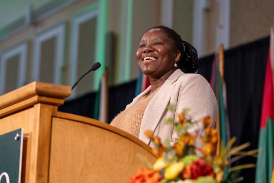 Bose Maposa speaks to the crowd in the Baker Ballroom during the Global Engagement Awards ceremony