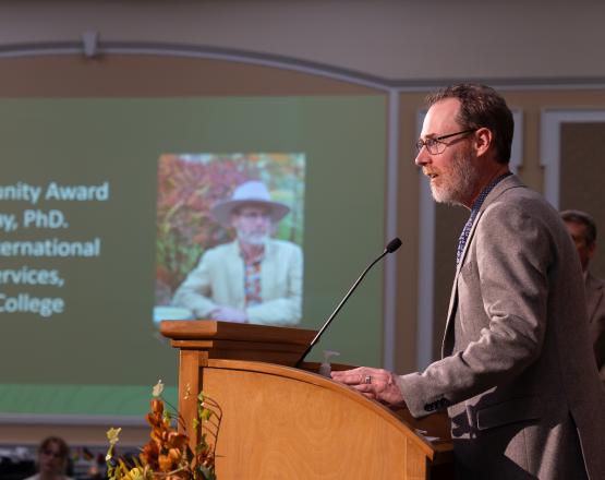 Andrew Ray speaks to the crowd at the Global Engagement Awards Ceremony in the Baker Ballroom