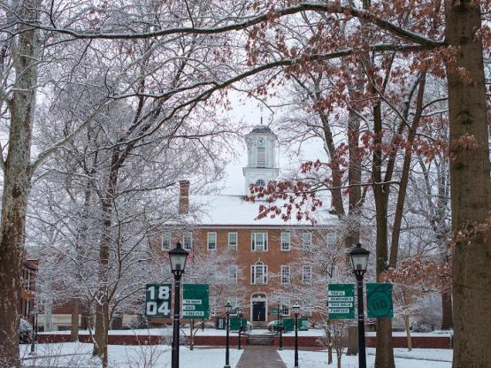 Cutler Hall and the College Green are shown covered in snow on a cold day in January 2025