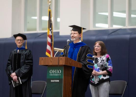  Dr. David Rohall speaks during an event at  