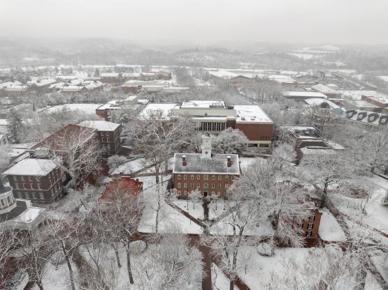 Cutler Hall,  the College Green and the trees and buildings nearby are covered in snow in this aerial image