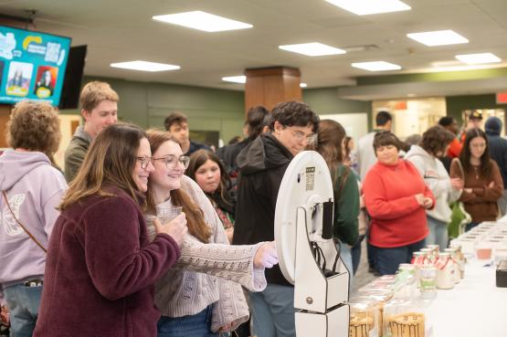 An Ohio student and her mother look at items at the 2024 Pop Up Market in Alden Library