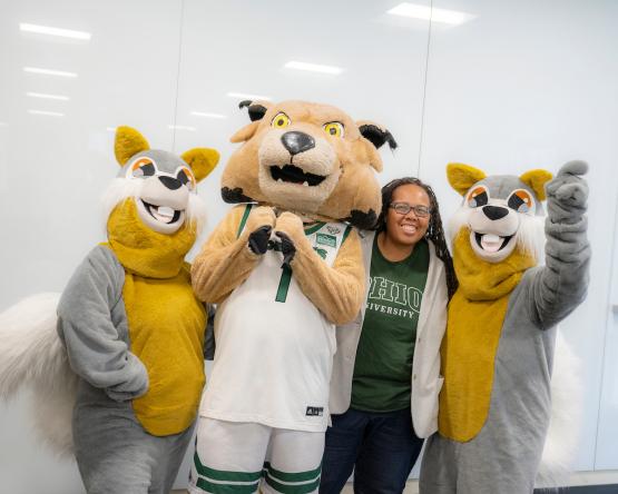 An OHIO leader poses for a photo with the Rufus and squirrel mascots 