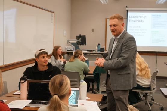 An instructor talks with OHIO students in a Leadership Launchpad program