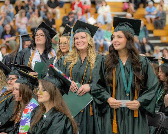 OHIO graduates are shown sitting and standing during the OHIO Chillicothe Graduation Recognition Ceremony