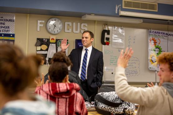 Luke Feeney is shown speaking to a class of students